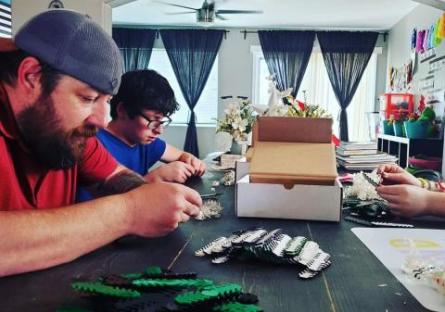 Tim Wilson and family assembling ear guards