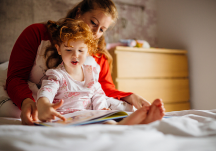 Mother and daughter reading a book